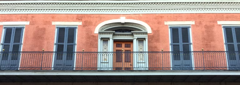 The balcony on the outside of the Hermann Grima House.